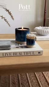The Ocean Pott lit on a coffee table at home